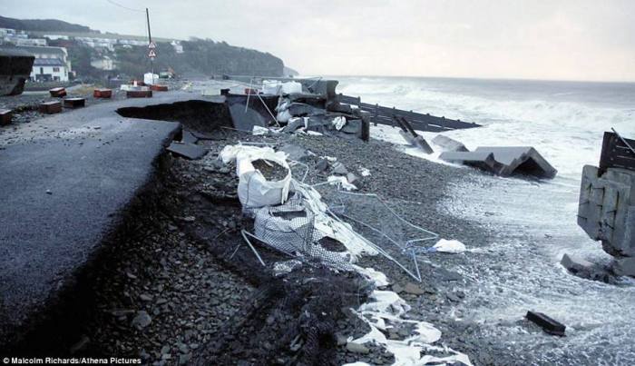 Significant damage to the coastal areas in Amroth, west Wales, UK where parts of the road were ripped up due to powerful sea waves and storm surge smashing onshore. All as a result of damaging winds associated by cyclone Ulla.