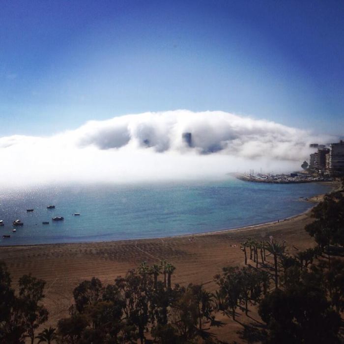 4-7-2014: dense fog / low cloudiness in Alicante, Spain today. The fog was literally "eating" the city! Source: Martha Strand on twitter via Cazatormentas.Net