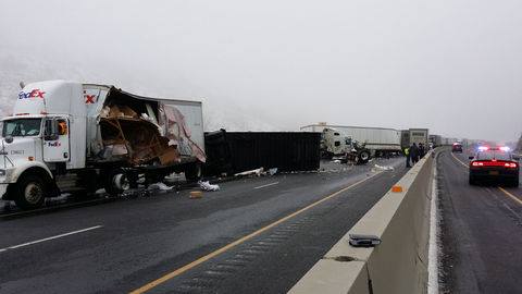 1-17-2015: State highway officials expected to reopen a long stretch of Interstate 84 on Saturday night, after a massive pileup of at least 26 vehicles – many of them semi trucks – east of Baker City shut the road down for most of the day. At 7:45 p.m., the Oregon Department of Transportation announced that the eastbound freeway is expected to open to one-lane travel within the next one or two hours. Twelve people were injured and treated at Saint Alphonsus Medical Center in Baker City for various injuries, hospital officials said. Six arrived by ambulance and six by third party, according to Oregon State Police. One patient was transferred to OHSU Hospital in Portland with serious injuries, one patient was transferred to St. Alphonsus Regional Medical Center in Boise, Idaho with serious injuries and two were brought to the Grande Ronde Hospital in La Grande for treatment, state police said. None of the injuries were believed to be life threatening. The pileup – caused before 5 a.m. by a treacherous combination of black ice, steep terrain and poor visibility – involved more than 12 semi trucks and trapped over 50 vehicles. More than 160 miles of eastbound lanes were closed from Pendleton to Ontario, as crews worked all day to remove cars, trucks and debris from the road. Westbound travel was also blocked from about 9 a.m. to 3:15 p.m. to facilitate the removal of "hazardous materials reported as cargo in at least two of the crashed trucks," according to ODOT. None of the hazardous materials were found to be leaking, but some fuel spilled onto the roadway, ODOT said. One truck had been transporting hydrochloric acid. Roads remained icy and slick on Saturday night, Hove said, adding that two other drivers slid off the freeway near North Powder. There were no serious injuries, said Sgt. Kyle Hove, an Oregon State Police spokesman. "It seems that there's some spots," Hove said. "It's a little bit deceiving because you'll be driving on firm roadway with good traction, and then you'll run into ice." http://www.oregonlive.com/